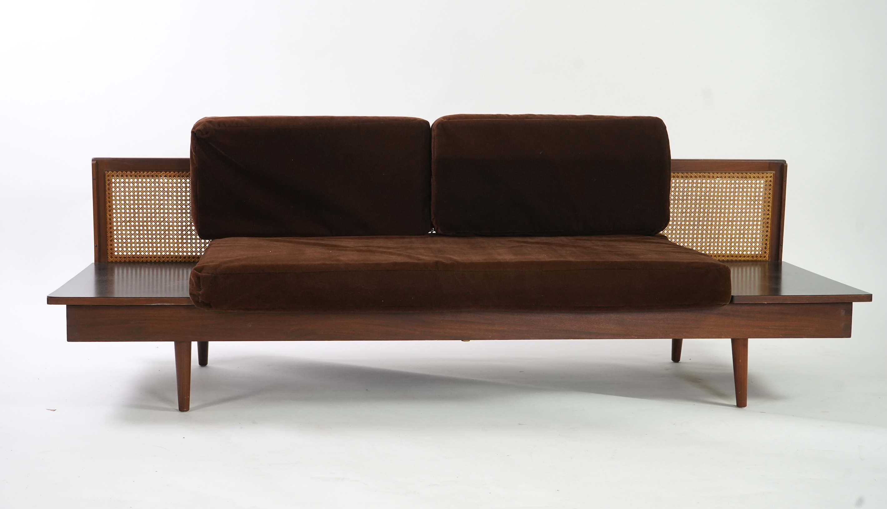 Dennis Young (British): A caned teak sofa/daybed